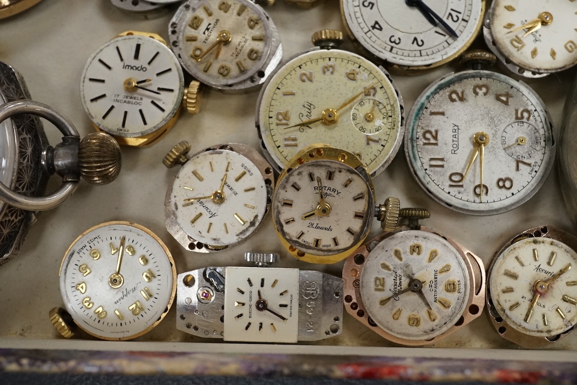 A quantity of assorted wrist and pocket watch movements, including Omega and Omega automatic, together with a pocket watch and a 935 white metal fob watch.